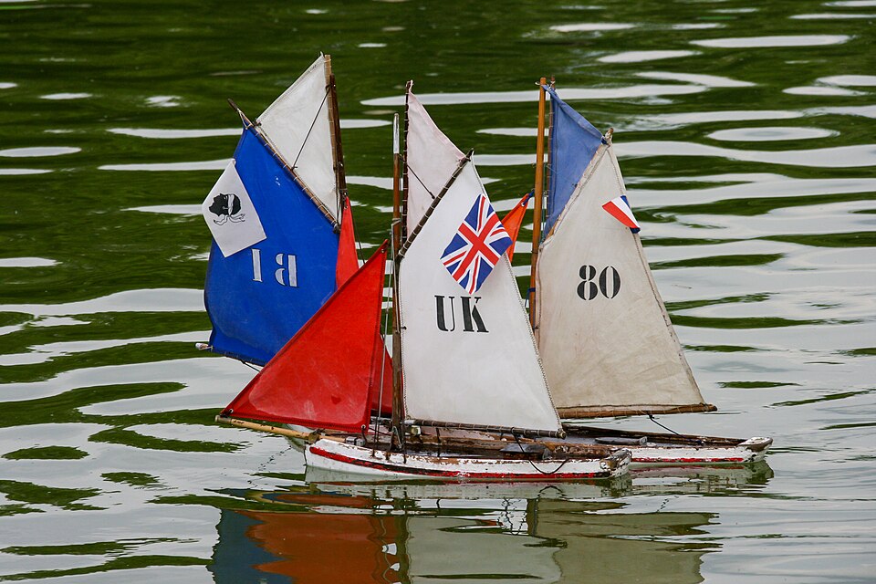 Children sailing toy boats on the Grand Bassin of the Luxembourg Garden